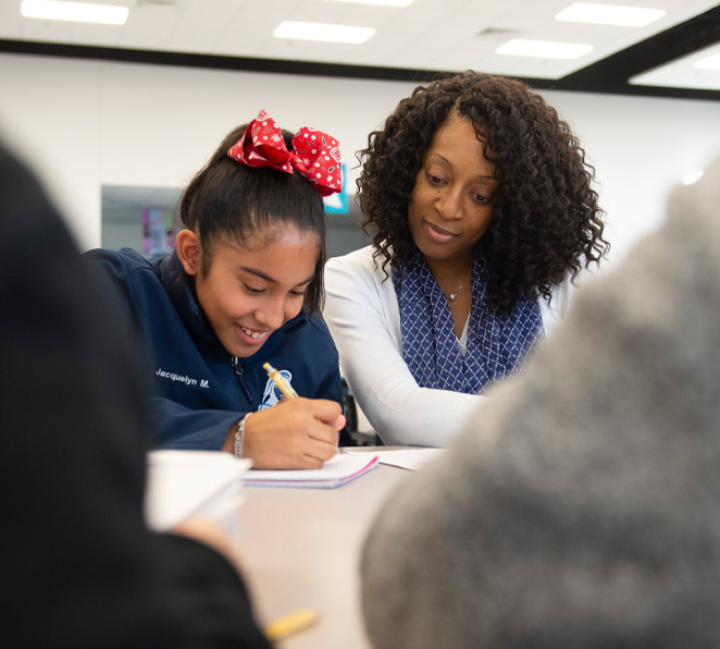teacher helping a student
