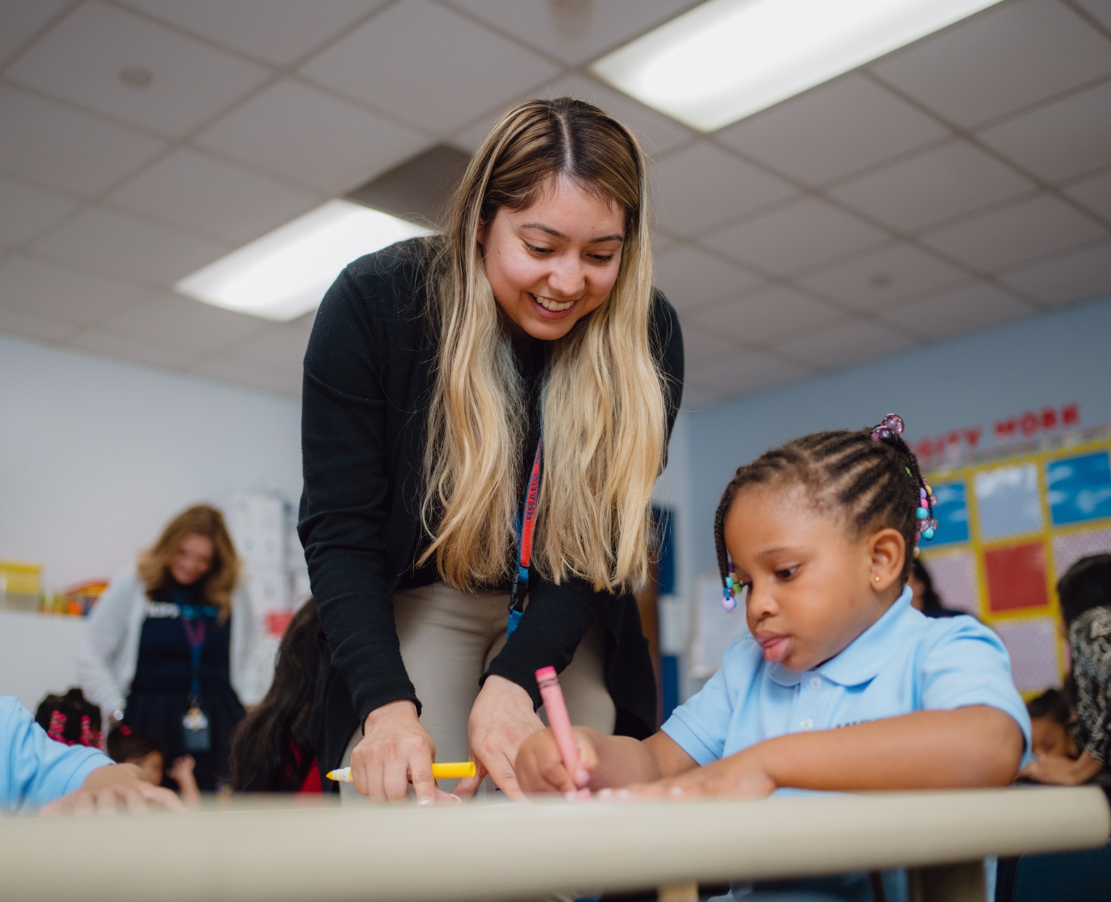 KIPP Texas Teacher Teaching Elementary Student