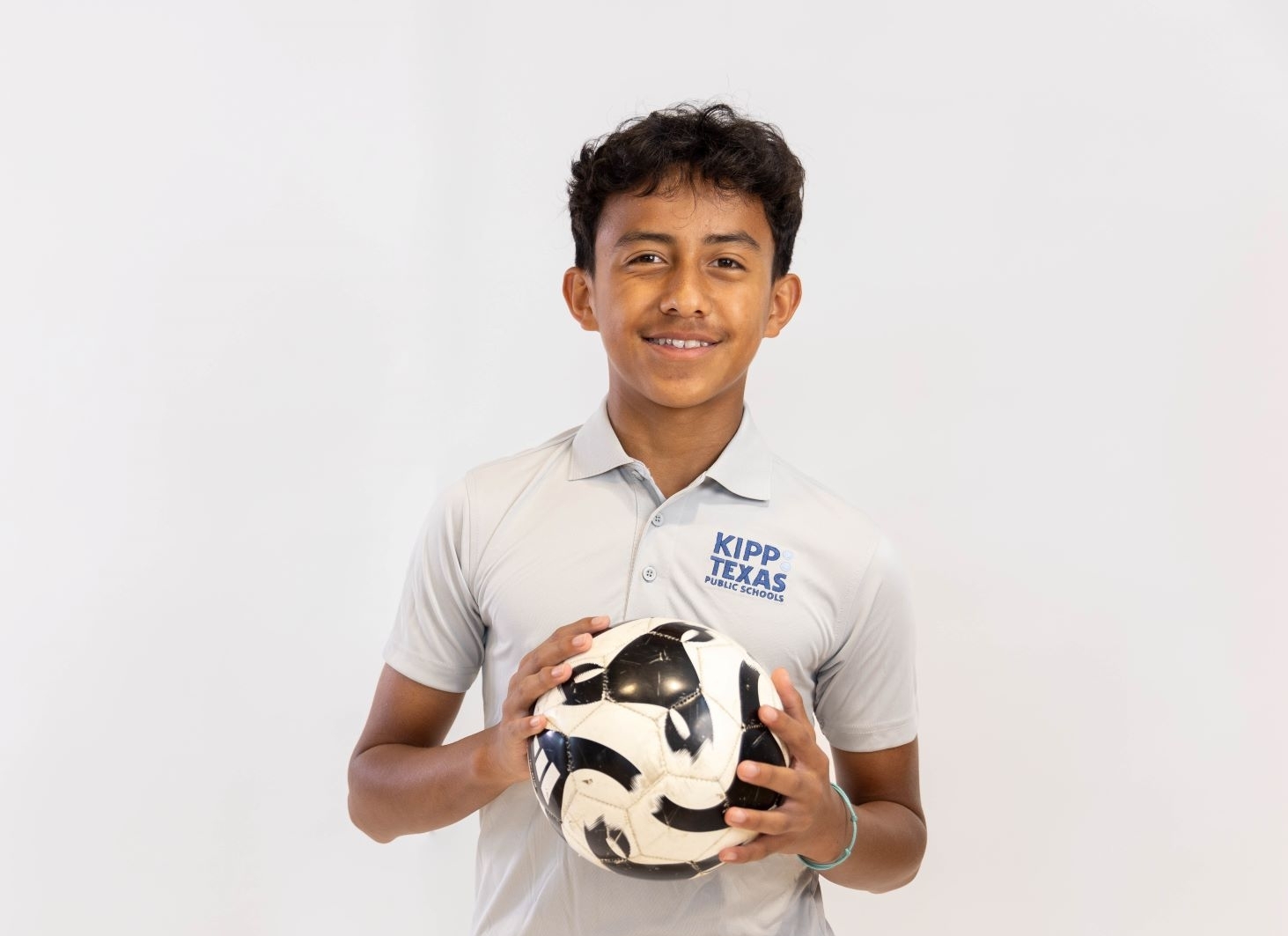 KIPP Texas Middle School Athlete Holding a Soccer Ball