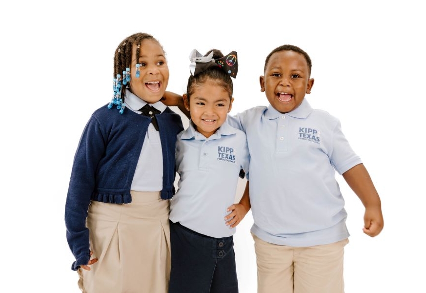 three-pre-k-students-smiling Three Pre-K Students Smiling