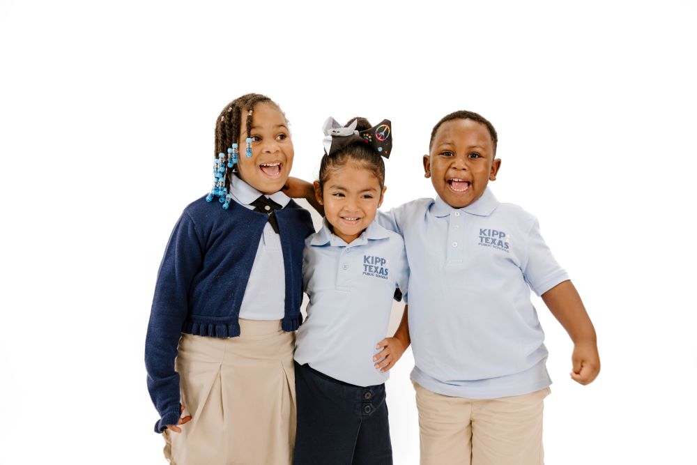 three-elementary-students-smiling