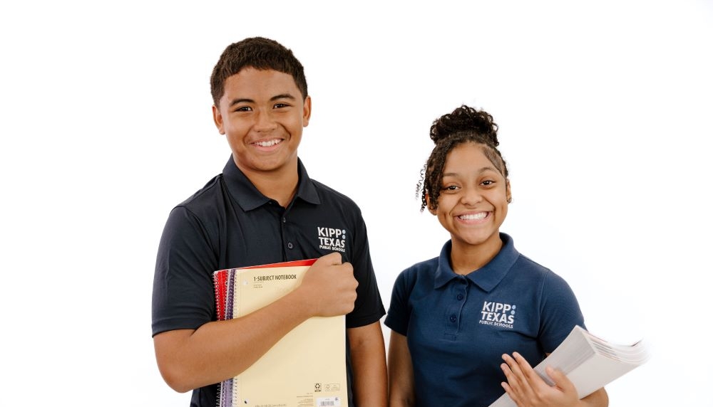 Two KIPP Texas Middle School Students Holding Books