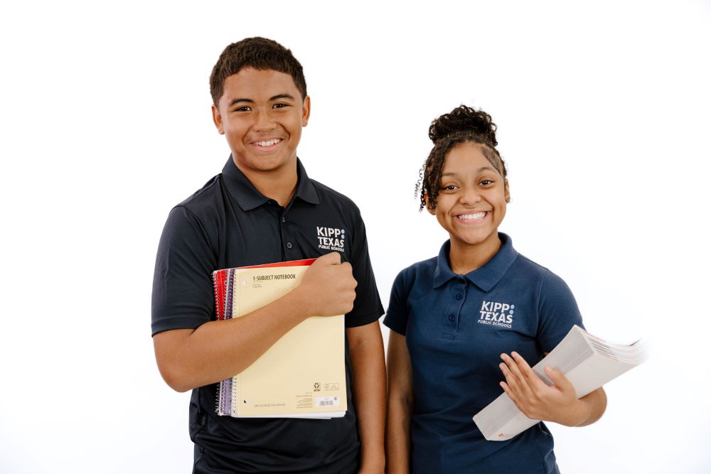 Two KIPP Texas Middle School Students Holding Books